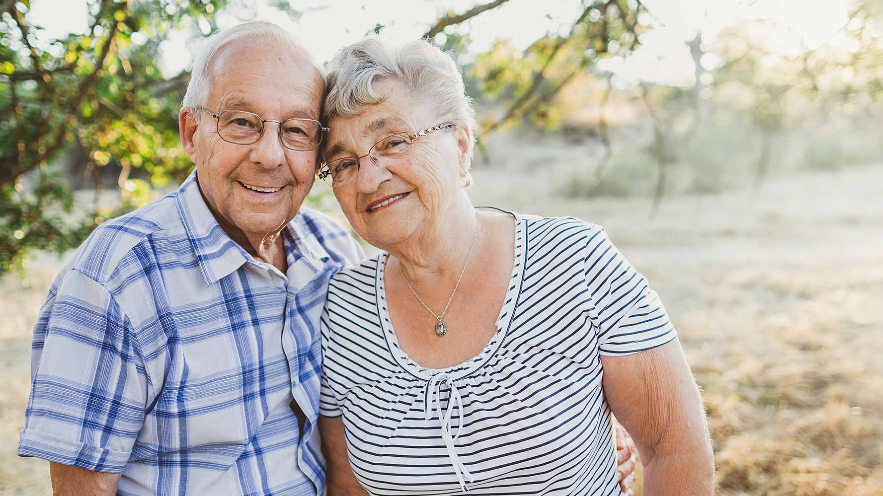 Older couple posing together